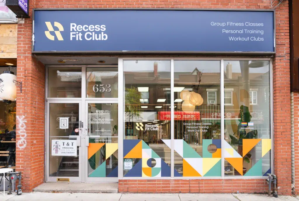 Exterior photo of Recess Fit Club gym with a colourful sign and display