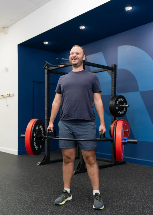 Person doing a deadlift with a hex barbell