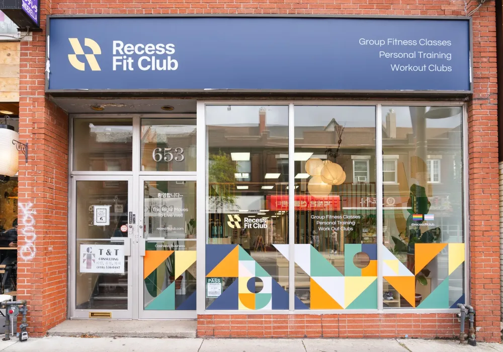 Exterior photo of Recess Fit Club gym with a colourful sign and display